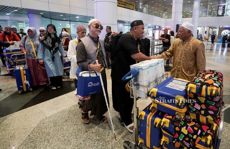 KUALA LUMPUR: Thirty visually impaired individuals selected to perform the Umrah pilgrimage on April 19 have safely arrived at Kuala Lumpur International Airport. - BERNAMA PIC 