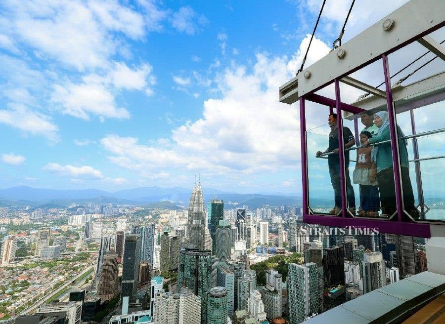 KUALA LUMPUR: Visitors looking at the view of the city from Kuala Lumpur Tower while spending time with their families during the Chinese New Year and school holidays. -- BERNAMA PIC