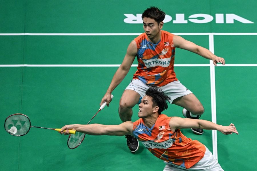 After a superb week of badminton in Ningbo, China, Malaysia's men's doubles duo Goh Sze Fei-Nur Izzuddin Rumsani settled for silver at the Asian Championships today. - AFP pic