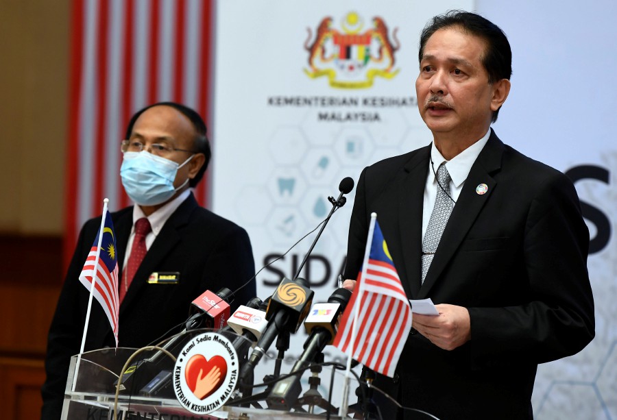 Health DG Tan Sri Dr Noor Hisham Abdullah addresses the media over the latest Covid-19 cases, during a press conference in Putrajaya. -BERNAMA pic