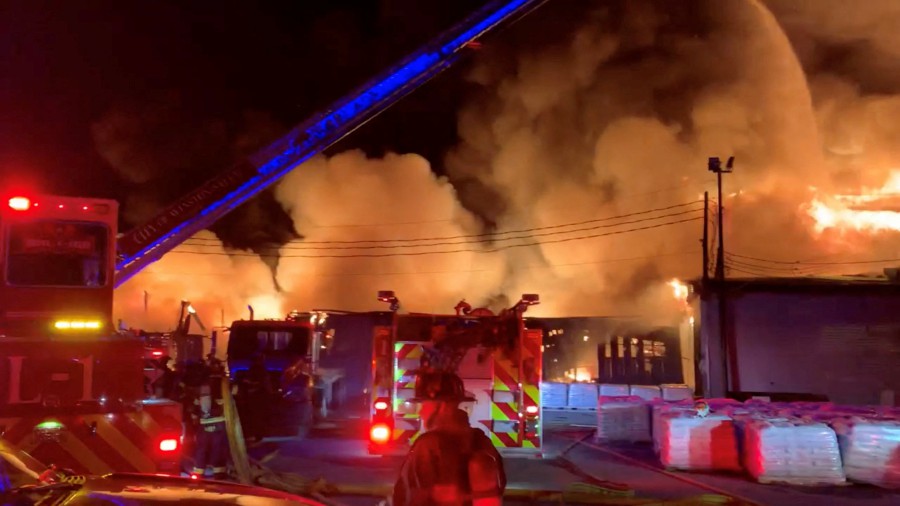 Firefighters battle a fire of burning Weaver Fertilizer Plant on Cherry Street in Winston-Salem, North Carolina, U.S., in this screen grab taken from a video recorded on January 31, 2022.  - REUTERS PIC 