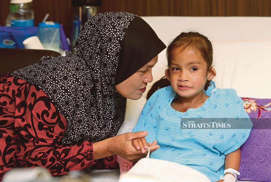 Nur Humayra Mohd Zaki and her mother Haliza Ismail, at Gleneagles Hospital in Kuala Lumpur yesterday. -NSTP/Rohanis Shukri