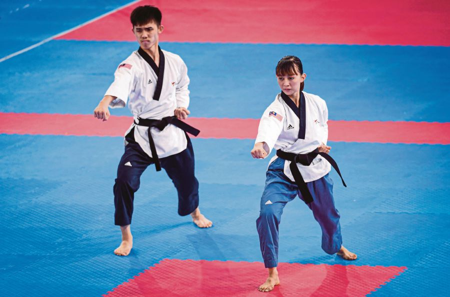 National taekwondo poomsae coaches are working on developing new talent following the retirement of Nurul Hidayah Abdul Karim (right). - Bernama file pic