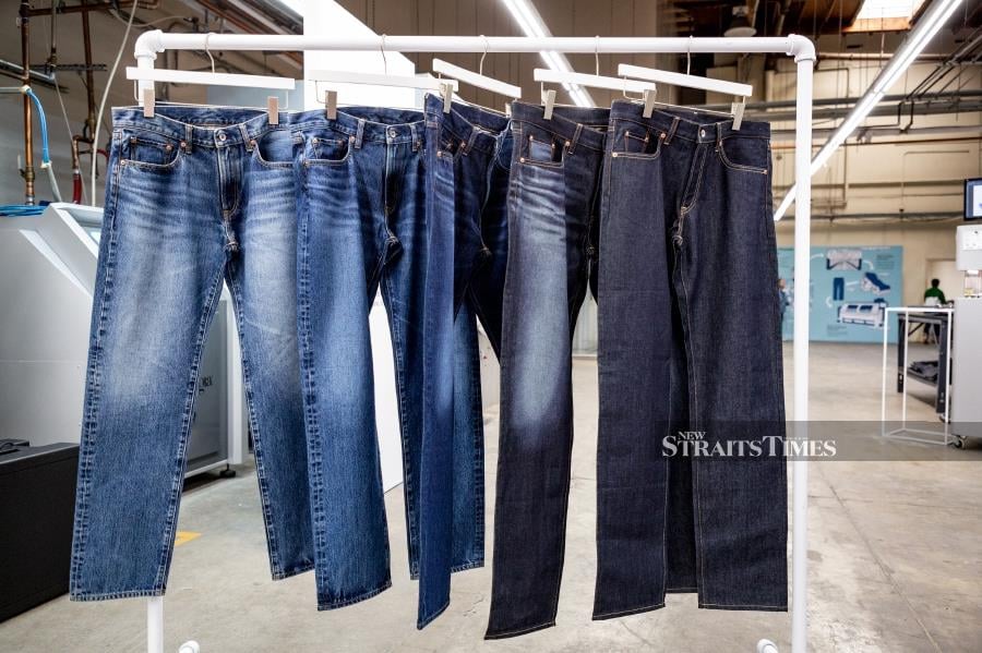 Raw jeans, as seen on the right, has its fans but most people prefer the worn-out look. Picture courtesy of Uniqlo.