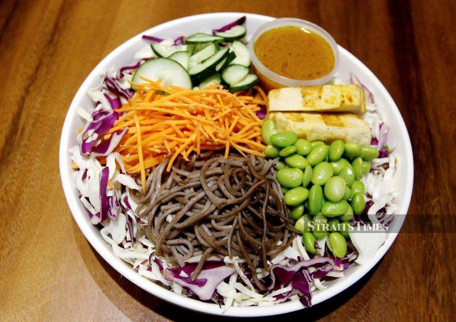 The Go Geisha salad with soba noodles, shredded cabbage and edamame is served with a light miso dressing.
