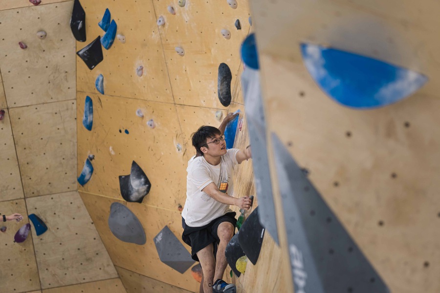 Bouldering works the entire body using only your body weight, relying on balance and core strength rather than brute upper body strength.