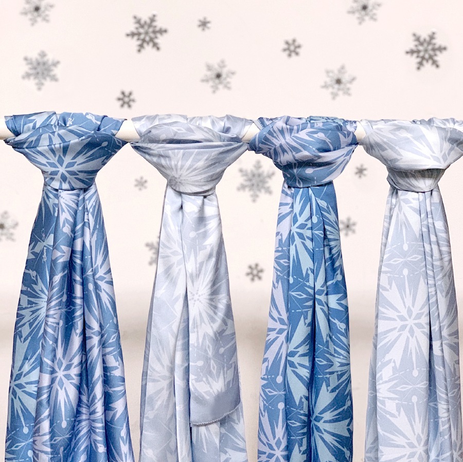 The print on the silk satin scarf is inspired by Frozen’s icy landscapes