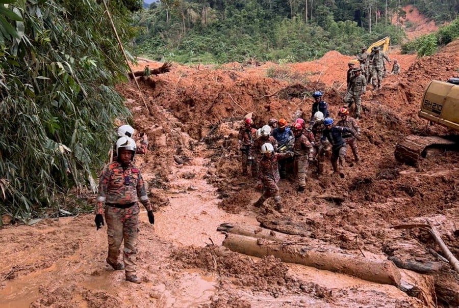 The landslide at the Father’s Organic Farm in Batang Kali has claimed the life of another -a girl - raising the death toll of the tragedy to 24. -Pic courtesy of Fire and Rescue Dept Selangor