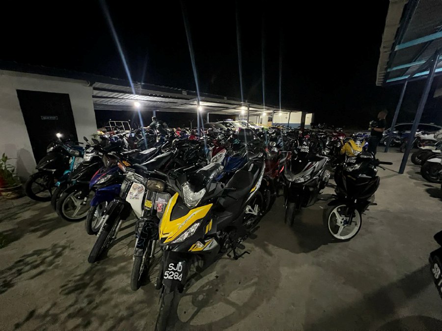 Some of the motorcycles seized during "Op Samseng Jalanan" in Sandakan yesterday. Picture courtesy of police