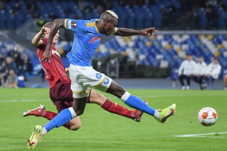 Napoli's Nigerian forward Victor Osimhen shoots to score the second goal during the UEFA Europa League Group C Football match between Napoli and Legia Warsaw on October 21, 2021 at the Diego-Maradona stadium in Naples. - AFP PIC