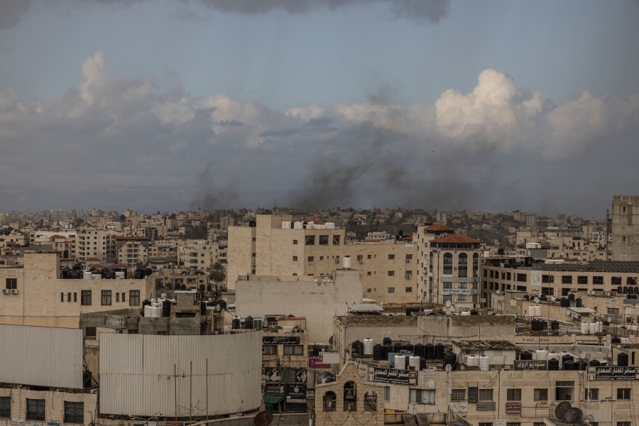 Smoke billows from the Jenin refugee camp in Jenin, during an Israeli army incursion.(Photo by MARCO LONGARI / AFP)