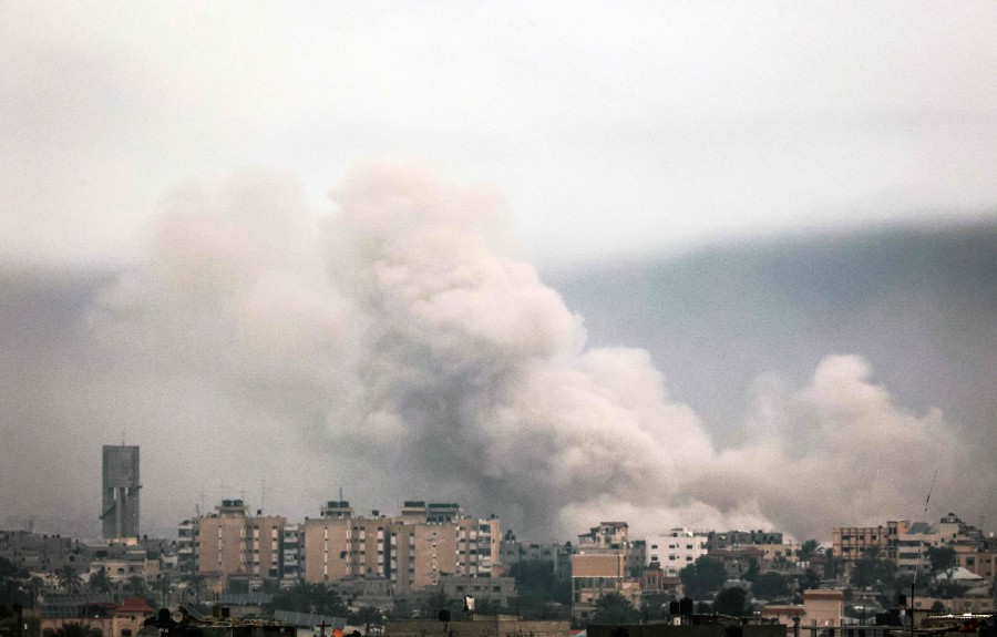 A picture taken from Rafah shows smoke billowing over Khan Yunis in the southern Gaza Strip during Israeli bombardment on January 21, 2024, amid ongoing battles between Israel and the Palestinian group Hamas. AFP PIC
