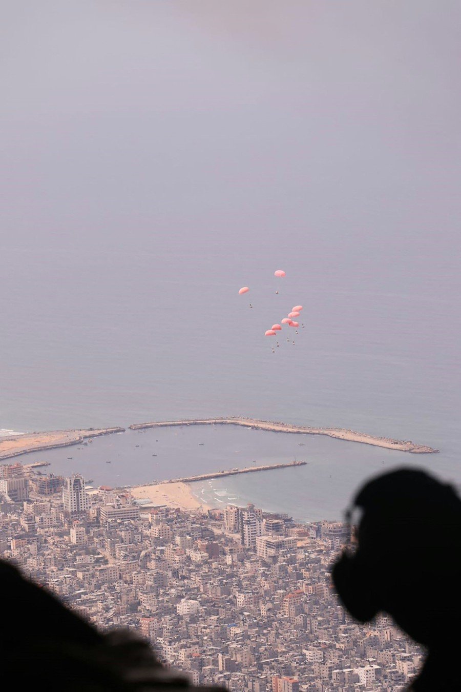 This handout picture released by the Jordanian army yesterday (March 16), shows humanitarian parcels being dropped from a German military aircraft over the northern Gaza Strip, amid the ongoing conflict between Israel and the Palestinian Hamas movement. — AFP