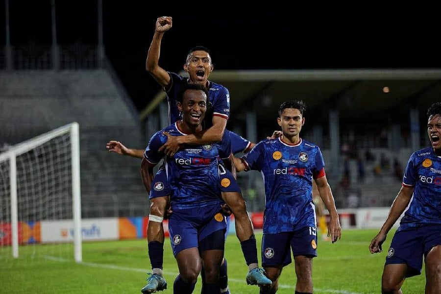 Police's Uche Agba celebrates scoring against Kuching City in the final return leg of the MFL Challenge Cup at State Stadium, Sarawak, today. - Pic courtesy from PDRM FC