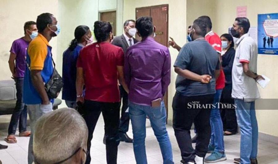  Twelve men were jointly charged at the Sessions Court here today for violating the standard operating procedures (SOP) by participating in a funeral procession last Wednesday (Oct 13). - NSTP/NUR IZZATI MOHAMAD. 