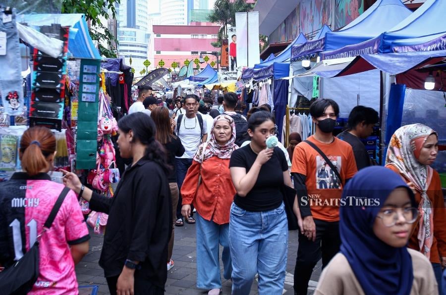 As the anticipated Hari Raya draws near, Jalan Tunku Abdul Rahman remains abuzz with eager shoppers looking to put the final touches on their festive preparations. - NSTP/AZIAH AZMEE