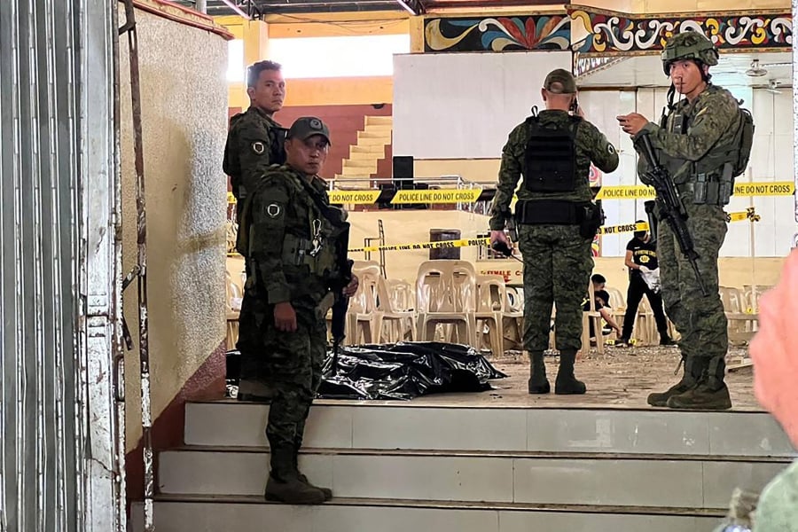 At least three people were killed and seven wounded in a bomb attack on a Catholic mass in the insurgency-plagued southern Philippines, officials said. (Photo by Merlyn MANOS / AFP)