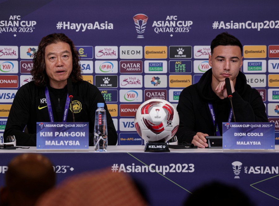 The Head Coach of Harimau Malaya, Kim Pan-Gon, and player, Dion Cools, during the pre-match press conference for Group E match between South Korea and Malaysia in the 2023 Asian Cup at the Main Media Center today. BERNAMA PIC