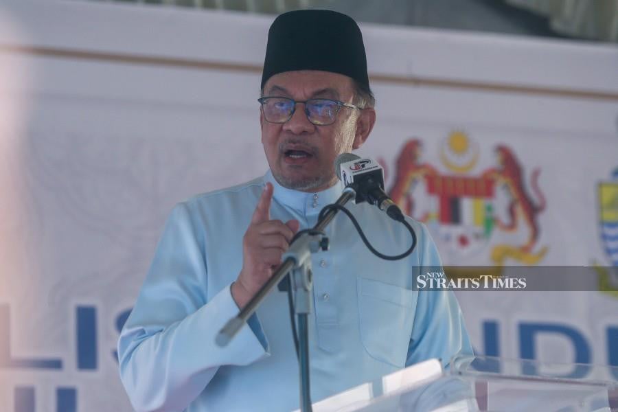 Prime Minister Datuk Seri Anwar Ibrahim has announced plans to propose a unique initiative during the upcoming cabinet meeting: Assigning one leader, himself included, to oversee the welfare of a village. - NSTP/DANIAL SAAD