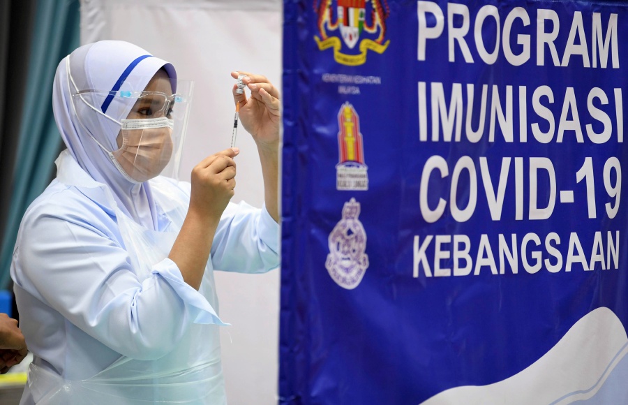 Malaysia may review its voluntary Covid-19 vaccination policy come July. - Bernama pic