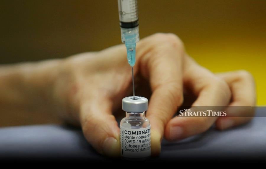Malaysia is set to receive another two million doses of the Pfizer-BioNTech Covid-19 vaccine in July, which will help speed up the vaccination process under the National Covid-19 Immunisation Programme (NIP). - STR/DANIAL SAAD