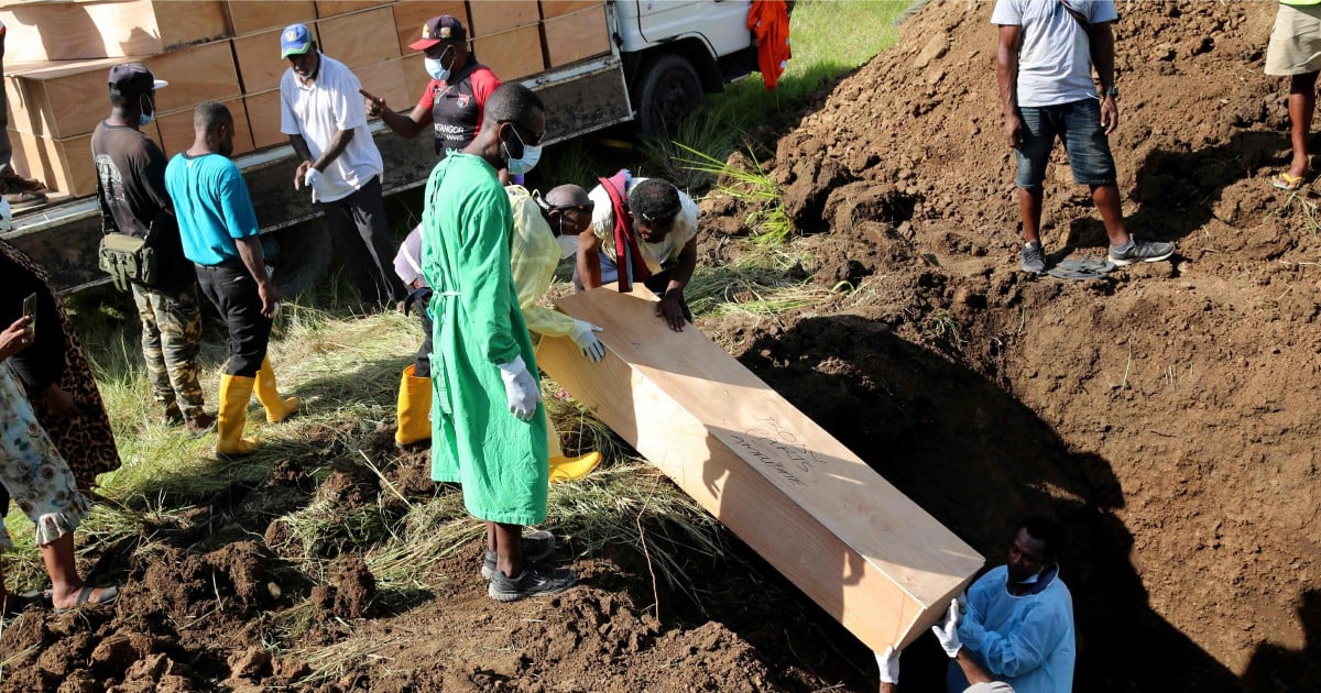 Papua New Guinea holds mass Covid burial