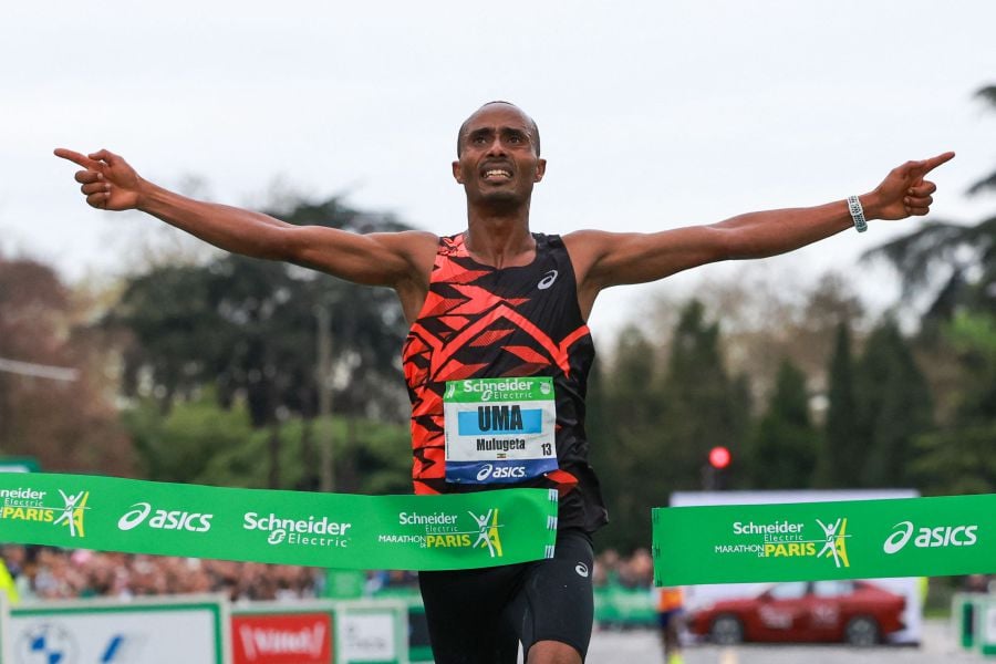 Uma Mulugeta of Ethiopia crosses the finish line to win the men’s marathon during the 2024 Paris Marathon, in Paris. - AFP pic