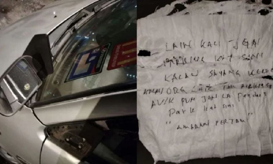 A man was shocked to find his car damaged after parking at a three-way intersection in a People’s Housing Project (PPR) area in Selangor. - Screengrab from social media