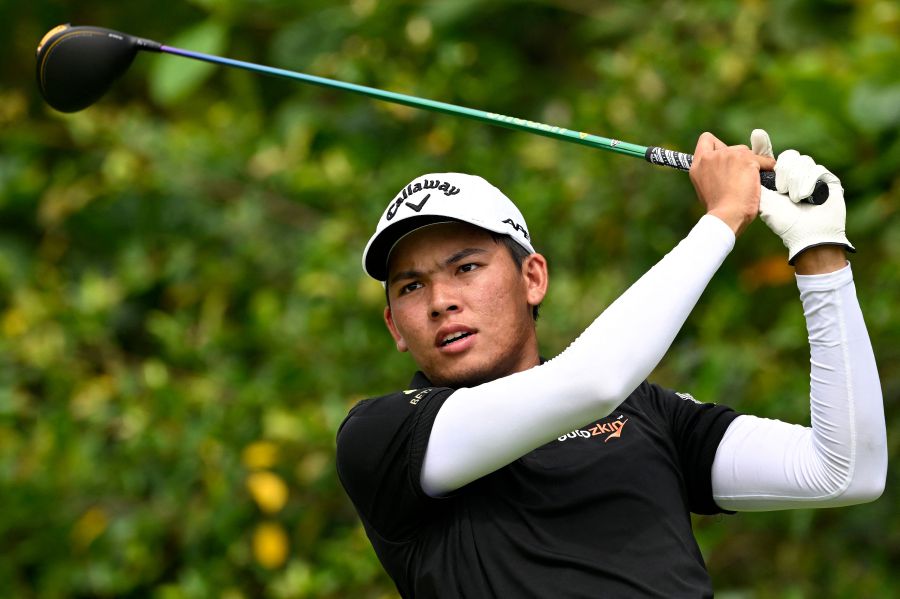 This handout photo taken and released by the Asian Tour on August 13, 2022 shows Phachara Khongwatmai of Thailand playing a shot during the third round of the International Series Singapore golf tournament at Tanah Merah Country Club in Singapore. - (Photo by Paul LAKATOS / Asian Tour / AFP)