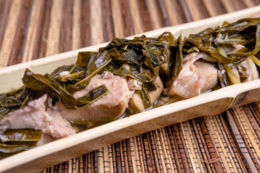 ‘Ayam Pansuh’ is a traditional Dayak delicacy consisting of chicken and tapioca leaves cocooned within bamboo. - File pic credit (Sarawak Tourism Board)