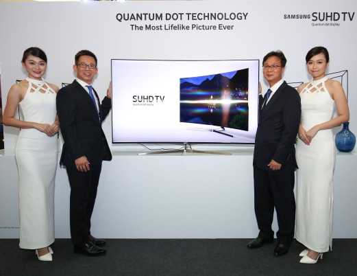 (From left) President of Samsung Malaysia Electronics Lee Sang Hoon, with Head of Consumer Electronics Business Jimmy Tan and models pose for a group photo.