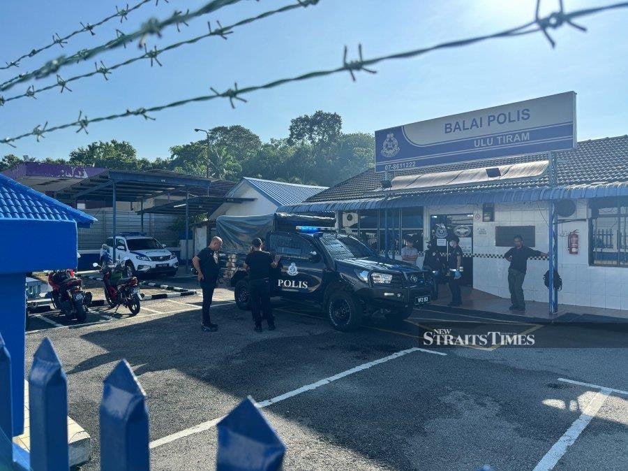 More than 50 plainsclothes policemen were seen patrolling around the Ulu Tiram police station here following an attack by a masked intruder early this morning. - NSTP/NUR AISYAH MAZALAN