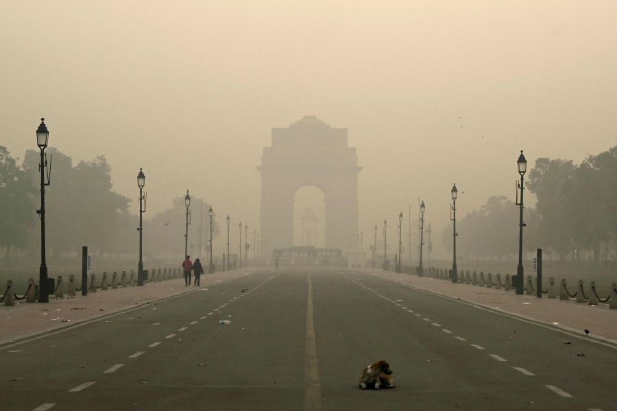 Pedestrians walk along the Kartavya Path in front of the India Gate amid heavy smoggy conditions in New Delhi. Delhi regularly ranks among the most polluted major cities on the planet, with a melange of factory and vehicle emissions exacerbated by seasonal agricultural fires. - AFP pic