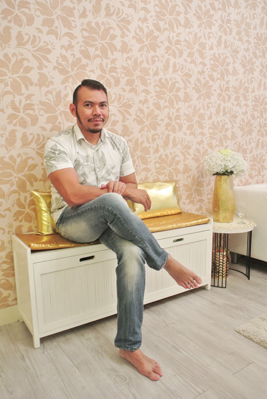 Faizal Zain posing in his minamalist glamour design apartment.