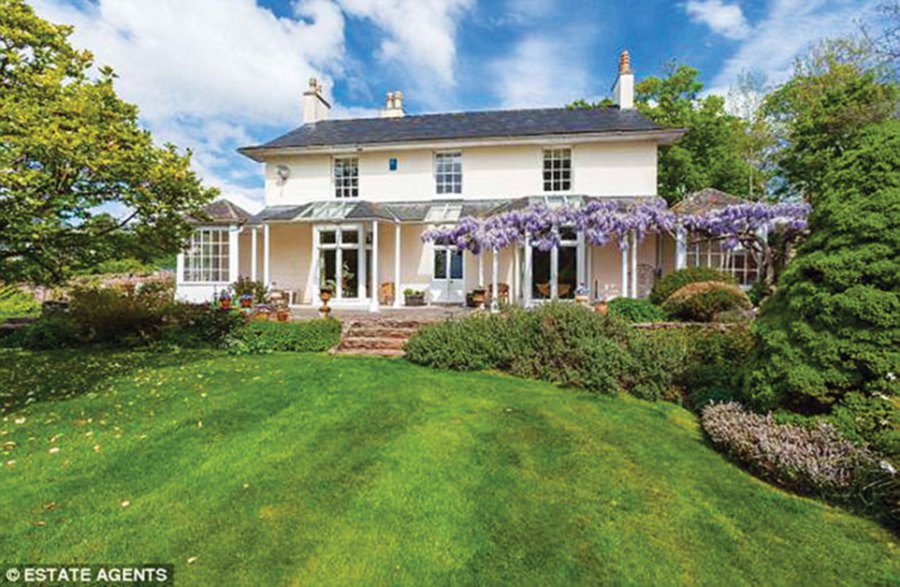 Court Place is a Grade II-listed wisteria-covered property in West Monkton, near Taunton, with five bedrooms. (Daily Mail PIC)