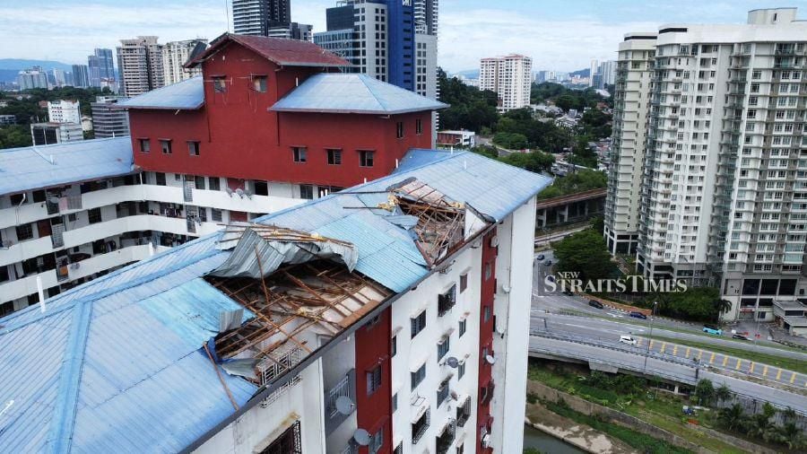  [nsDrone footage by the New Straits Times reveals the extent of the damage at Putra Ria Apartments, showing multiple areas where the roof was ripped off during a storm. - NSTP / EFFENDY RASHID