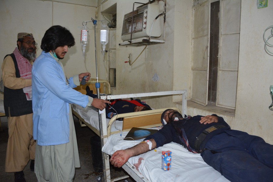 A paramedic provides medical care to injured victims at a hospital following an explosion in Quetta. - AFP pic