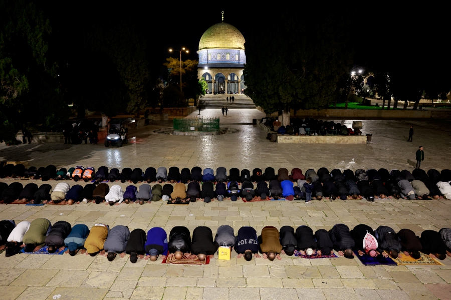 Muslim worshippers take part in the evening 'Tarawih' prayers during of the Muslim holy month of Ramadan, at Al-Aqsa compound, known to Jews as Temple Mount, in Jerusalem’s Old City. (REUTERS/Ammar Awad)