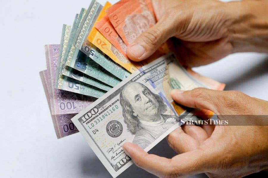 The ringgit ended lower against the US dollar today (January 15) amid a lack of catalysts, extending last week’s downtrend. - NSTP file pic