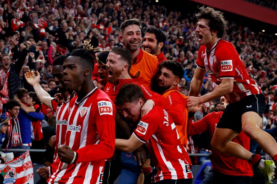 Athletic Bilbao's Inaki Williams celebrates scoring their third goal with teammates. -REUTERS pic