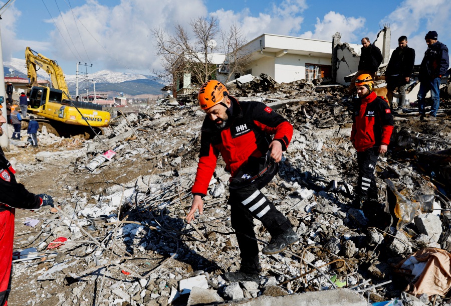 Rescuers work near the site of a collapsed building following an earthquake in Gaziantep, Turkey, February 7, 2023. - REUTERS Pic