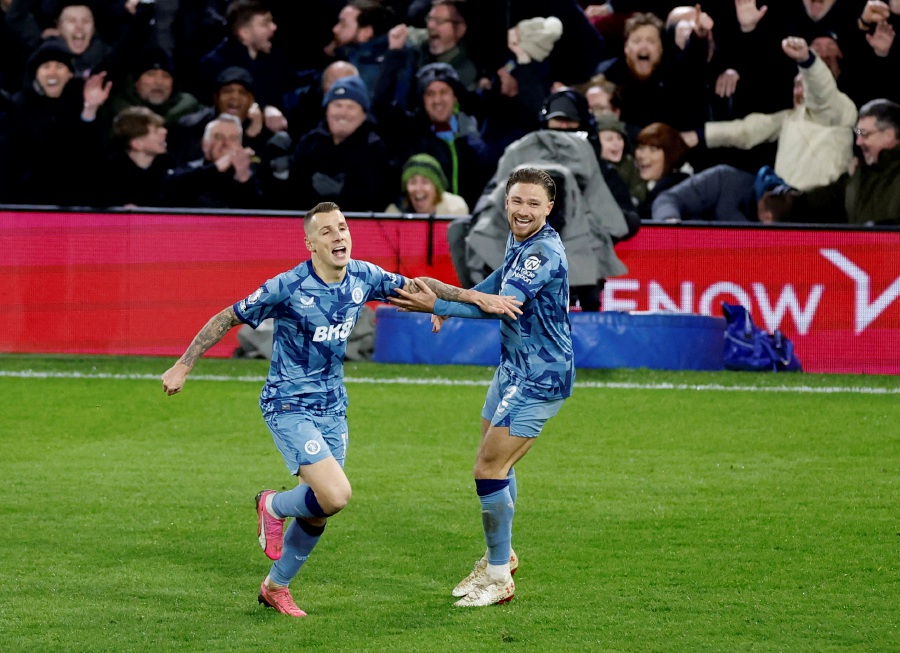 Aston Villa's Lucas Digne celebrates scoring their third goal with Matty Cash. - Reuters pic