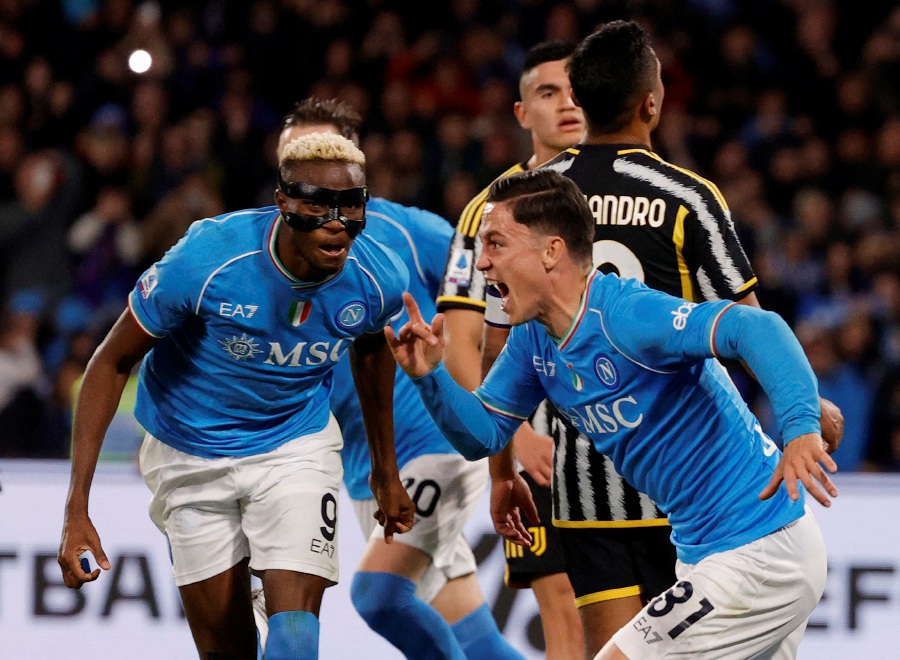 Napoli's Giacomo Raspadori celebrates scoring their second goal with Victor Osimhen. - REUTERS PIC