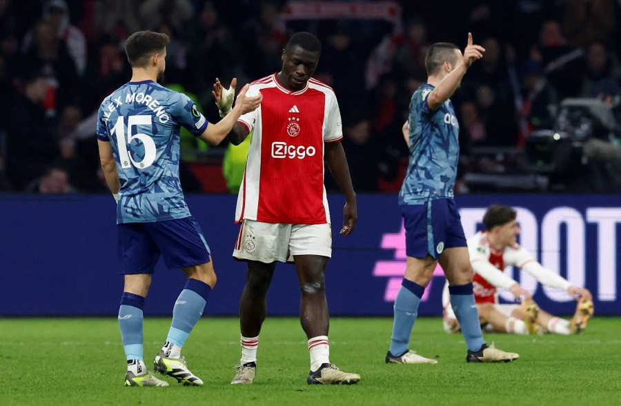 Ajax Amsterdam's Brian Brobbey shakes hands with Aston Villa's Alex Moreno after the match. - REUTERS pic
