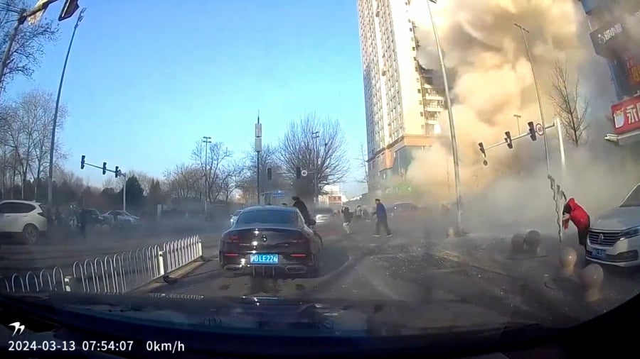 A dashcam view shows people fleeing following an explosion in Sanhe, Langfang City, Hebei Province, China in this screen grab from video. - Reuters pic