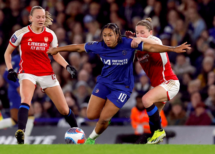 Chelsea's Lauren James in action with Arsenal's Kim Little. - Reuters pic