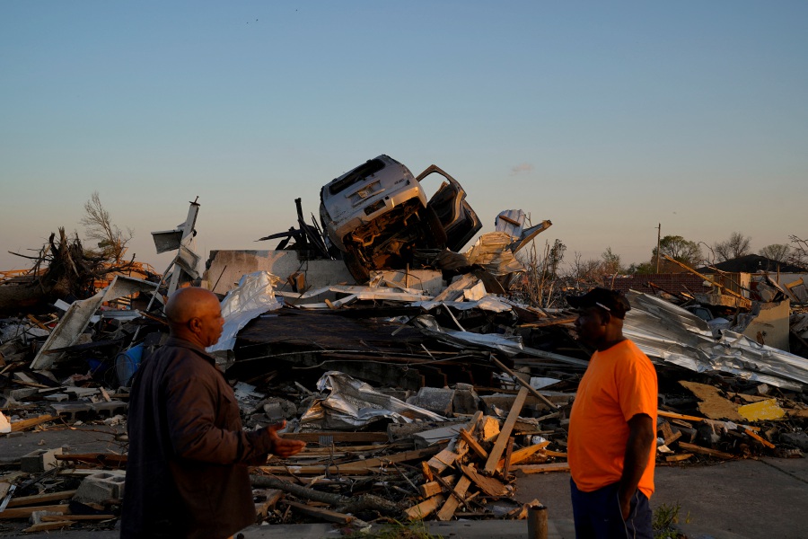 A vehicle sits on top of a pile of rubble after thunderstorms spawning high straight-line winds and tornadoes ripped across the state in Rolling Fork, Mississippi, U.S., March 25, 2023. - REUTERS Pic