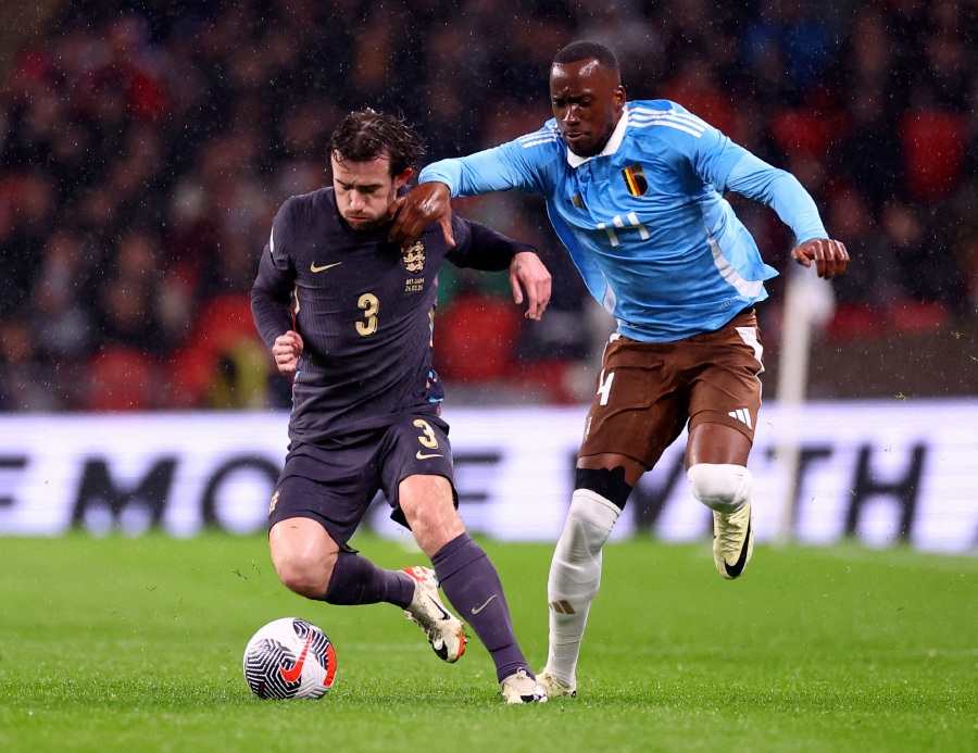 England's Ben Chilwell in action with Belgium's Dodi Lukebakio. - REUTERS PIC