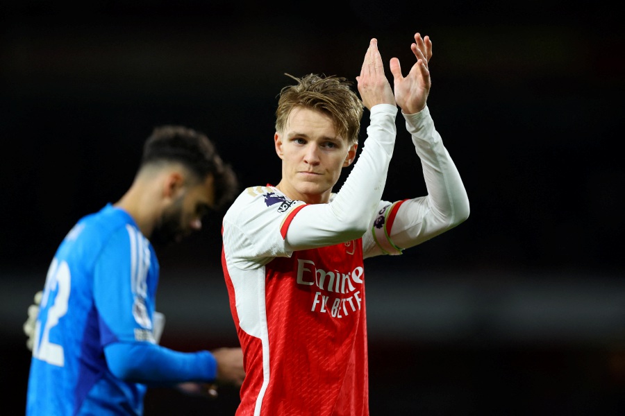 Arsenal's Martin Odegaard celebrates after the match. - REUTERS pic