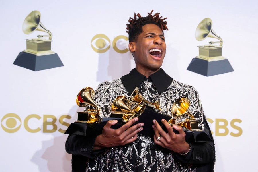 Jon Batiste poses with their Grammys for Best American Roots Performance for "Cry," Album of the year for "We Are," Best American roots song, Best music video and Best score soundtrack for visual media for “Soul," at the 64th Annual Grammy Awards at the MGM Grand Garden Arena in Las Vegas. - REUTERS Pic